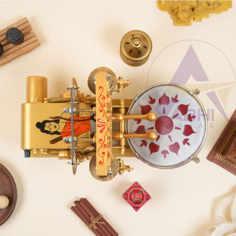 Electric mini arti machine with ram ji carving on it and orange painted